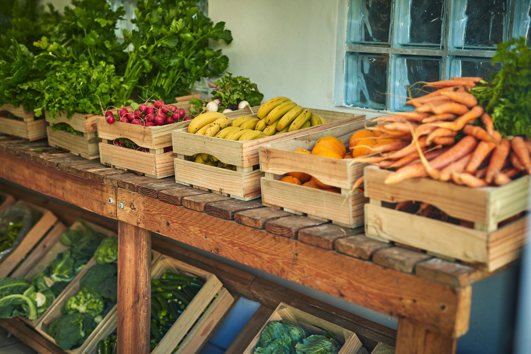 Fresh seasonal vegetables displayed in crates