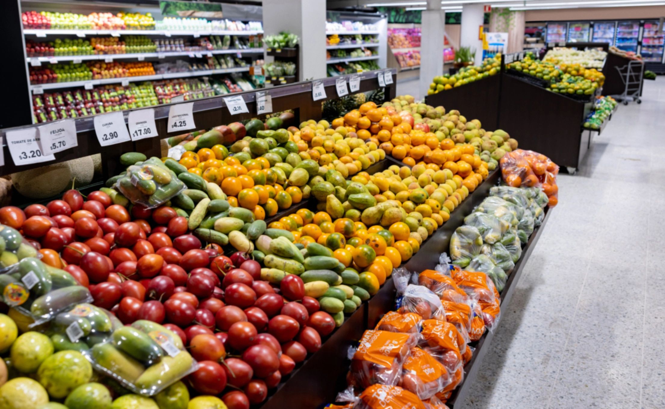 Wide produce display showing a variety of fresh vegetables