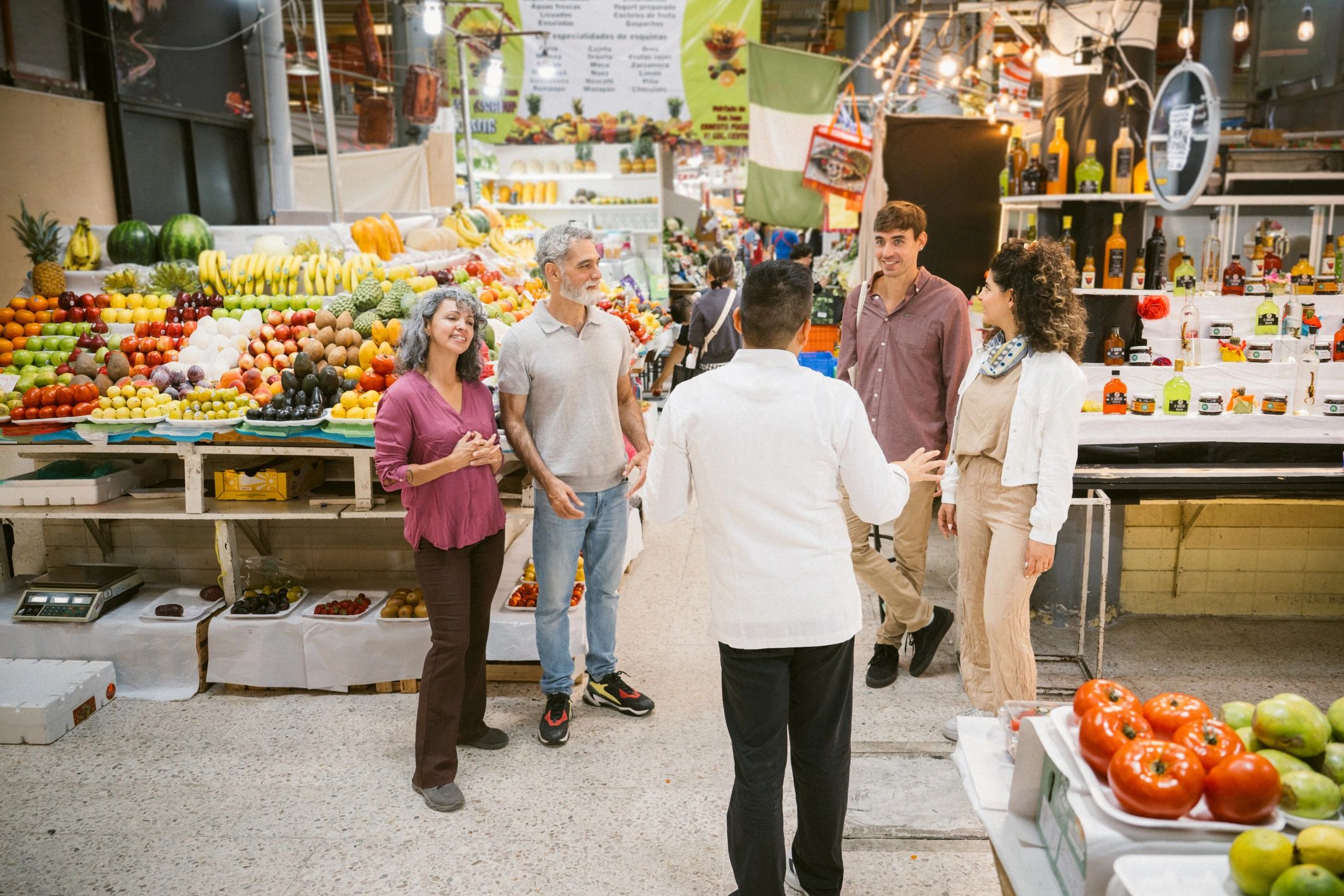 Outdoor produce stand serving festival visitors